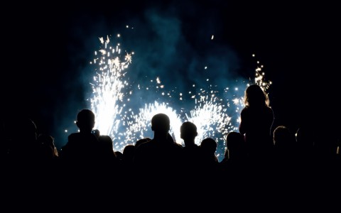 people in front of a fireworks